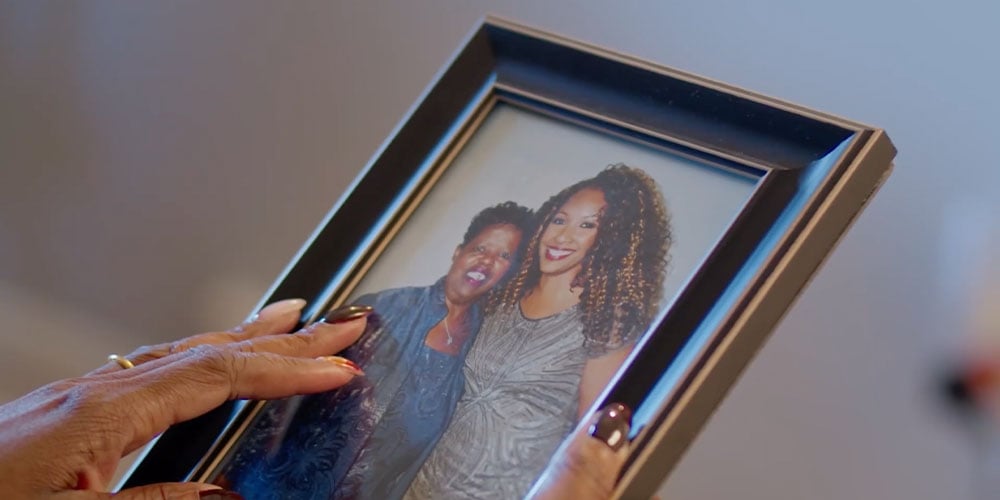 An screenshot of an image of a woman and her mother in a photo frame